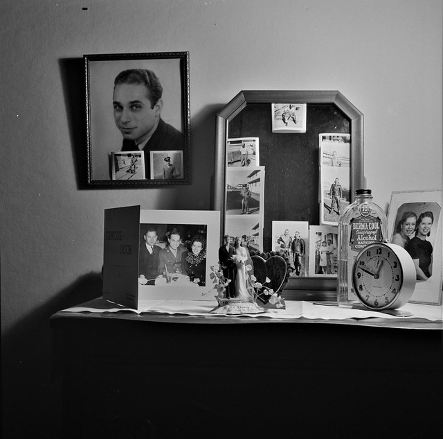 A Dream for Two: Pictures of a husband in the service decorate the dresser and mirror of this boardinghouse resident. Washington, D.C., January 1943.