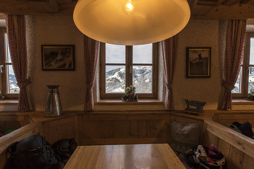 wood mountain mountains alps salzburg window table austria wooden europe cottage hills region wagrain people coffee lamp painting landscape lunch view no wideangle indoor sittingarea