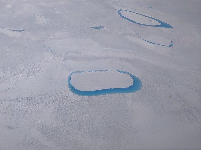 Flying over partially ice-covered lakes