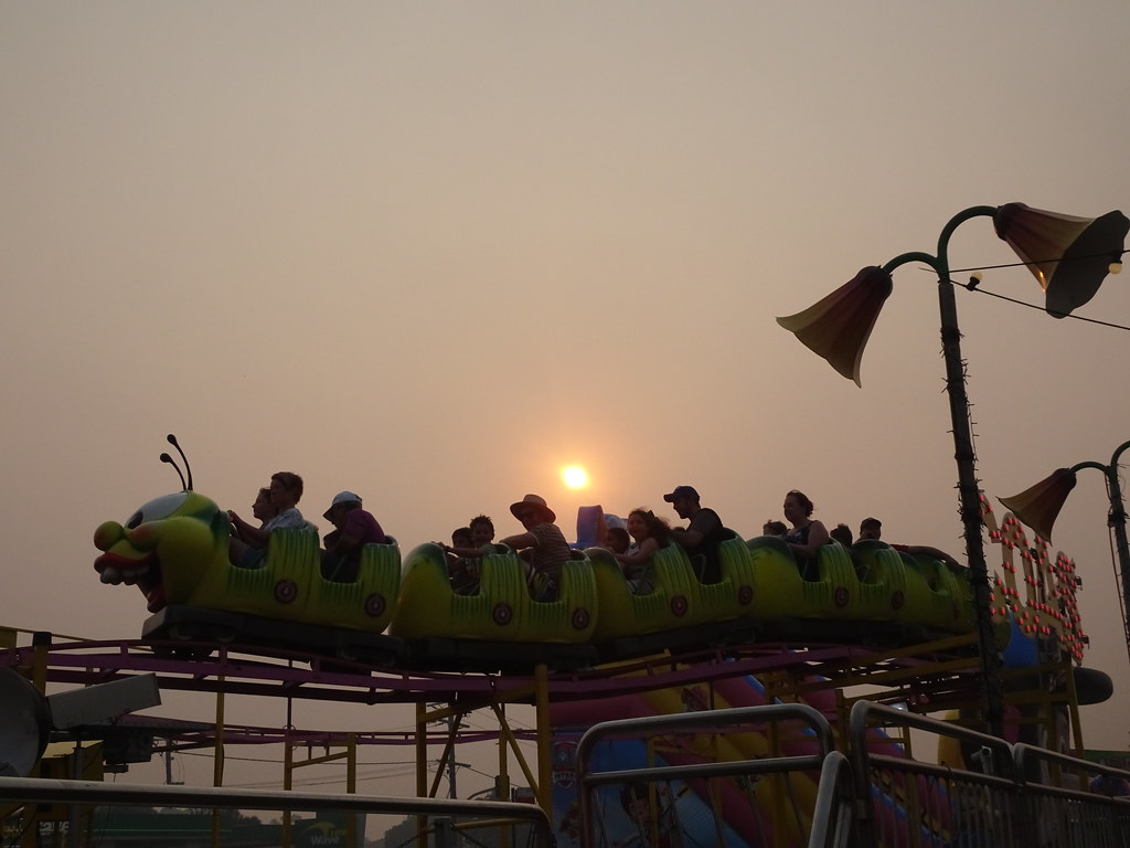 Carnival Ride, People enjoy a ride on the Wacky Worm Roller…