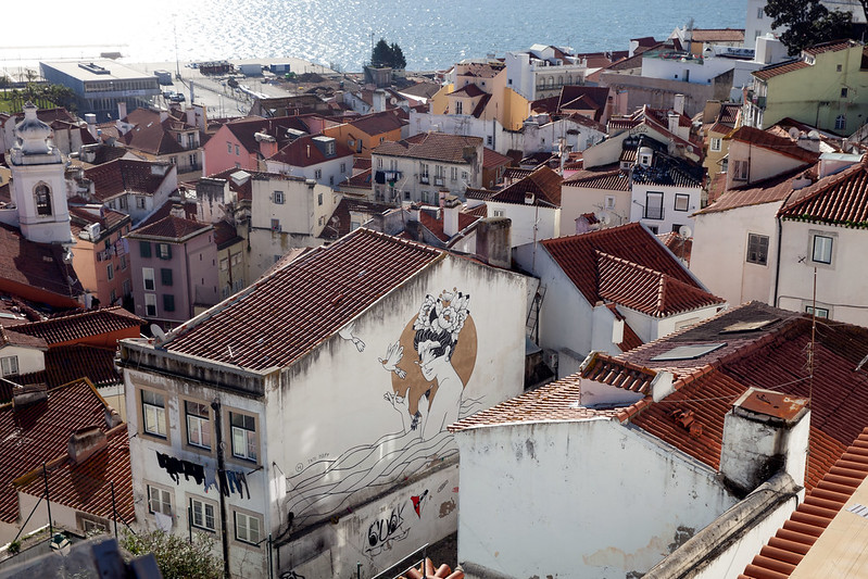 A view of some beautiful street art and the Rio Tejo