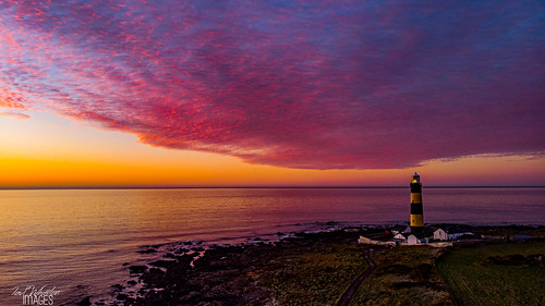 downpatrick northernireland unitedkingdom lighthouse sky red sunrise sea