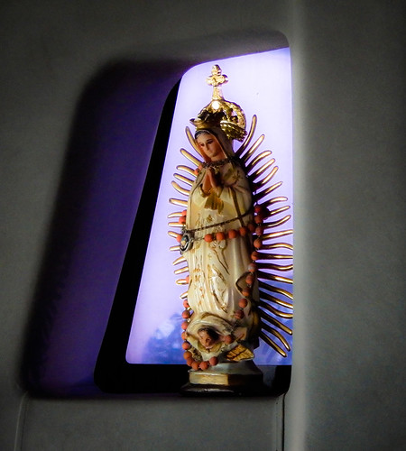 The Virgen de Guadalupe guards over us as we ride the bus to Lázaro Cárdenas, Mexico