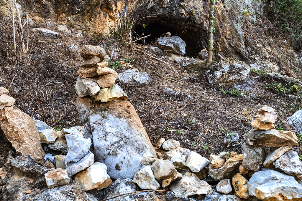 Small rock piles outside cave at Plain of Jars Site 1--Phonsavan