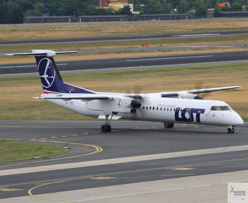 LOT Polish Airlines DHC-8-Q402 OY-YBZ taxiing at TXL/EDDT