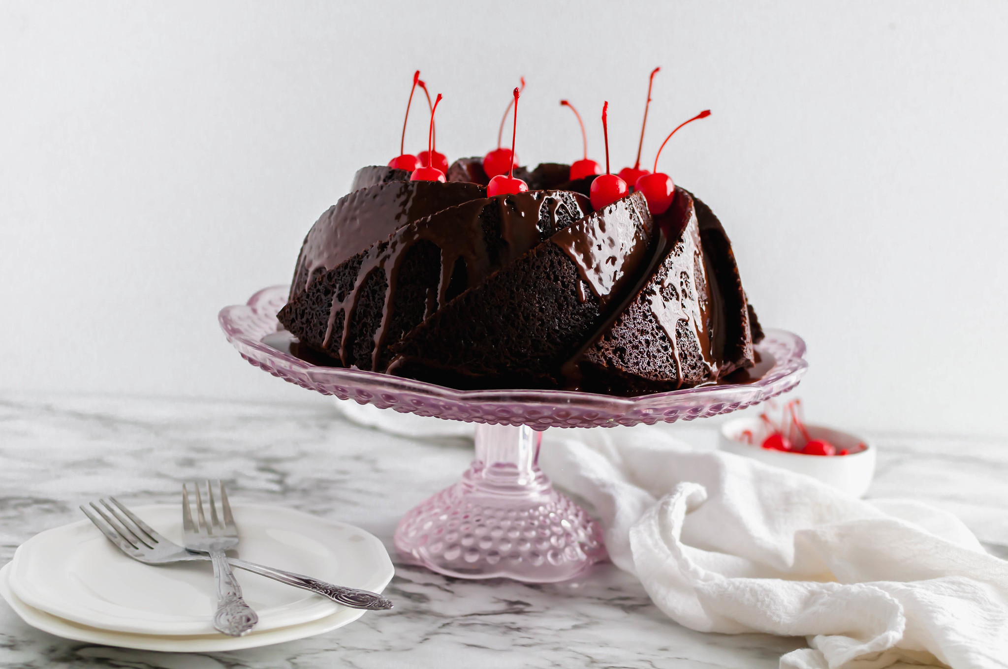 Celebrate National Chocolate Cake Day with this Chocolate Cherry Cake. It's incredibly rich and packed with fruity maraschino cherries.