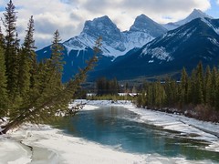 The Bow River in Canmore, backdropped by the iconic Three Sisters