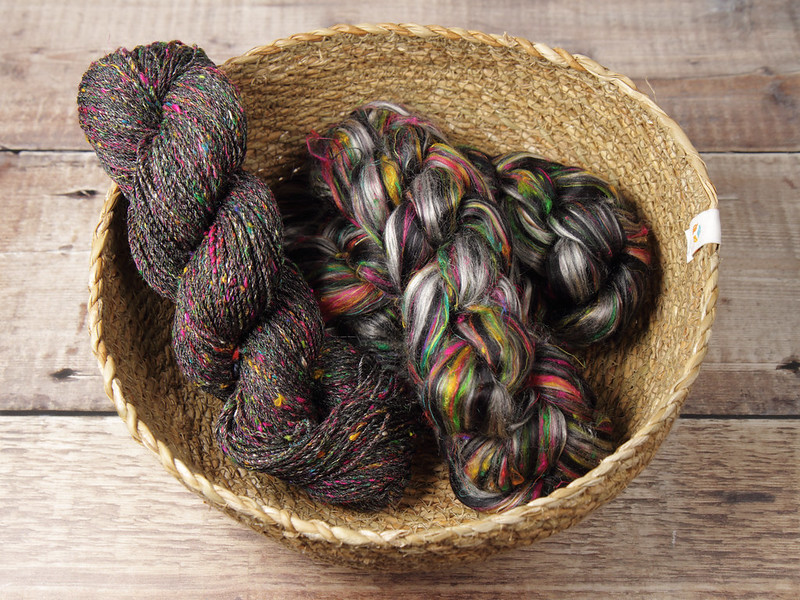 A basket containing Karma Blend fibre and handspun yarn