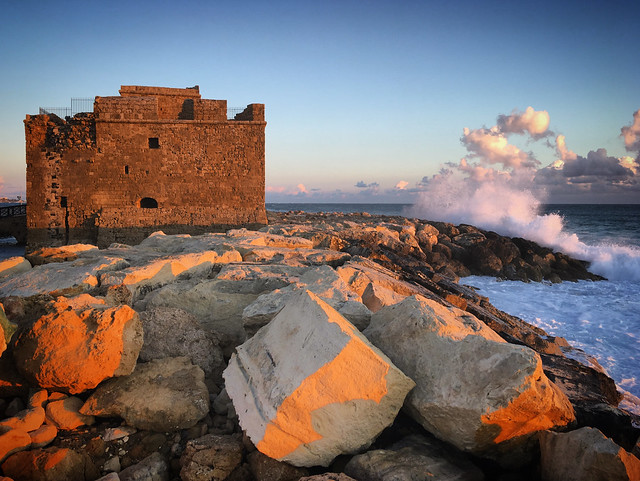 Ruins of the old castle on the coast of the stormy Mediterranean Sea in Paphos, Cyprus, March 2019