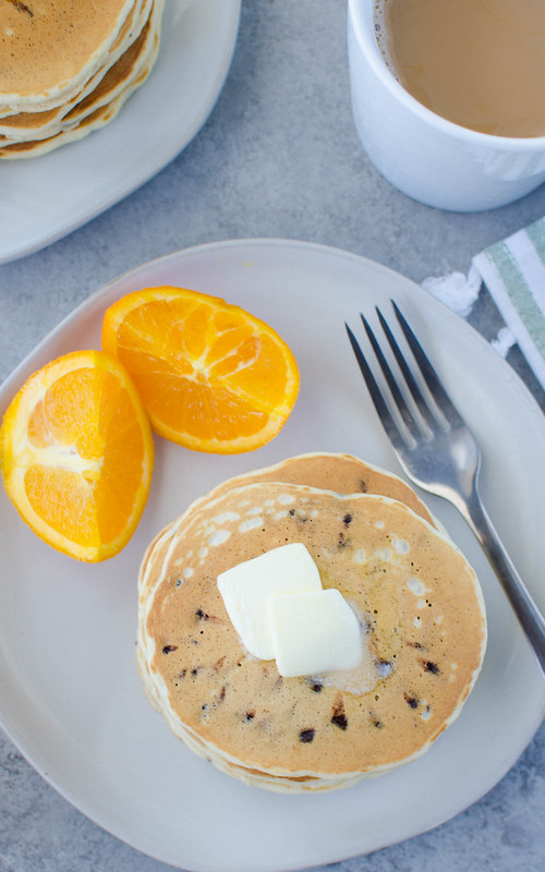 Chocolate Chip Pancakes - the perfect weekend breakfast! Fluffy buttermilk pancakes filled with mini chocolate chips. 