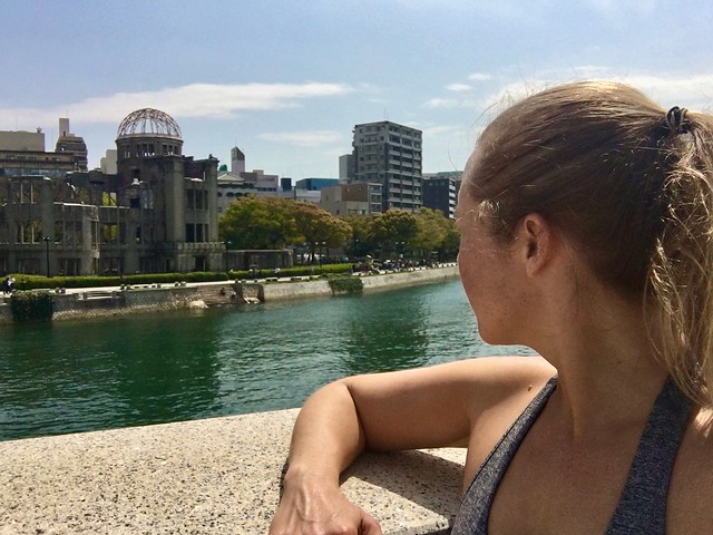 girl looking at hiroshima atomic bomb dome