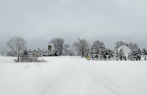 snowy snow snowcovered wisconsin oshkoshwisconsin winter farm silos barns farms trees roads stopsign stop slipery snowstorm winterstorm rurallandscape rural landscape