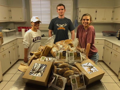 Students with boxes of packaged food.