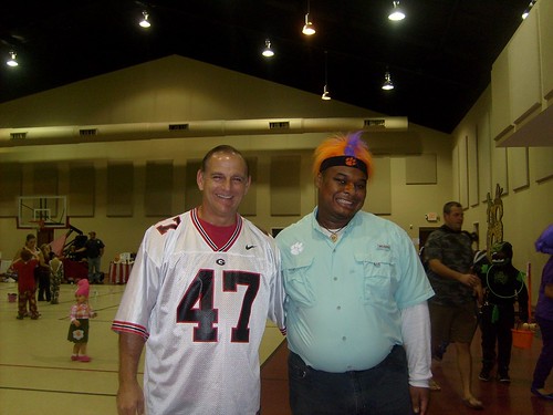 A house divided...Me as a Clemson Tiger fan; my friend Pastor Steve Dees as a Georgia Bulldog fan wearing my David Pollack Georgia Bulldogs jersey at St. George Baptist Church Fall festival in October 31, 2015.