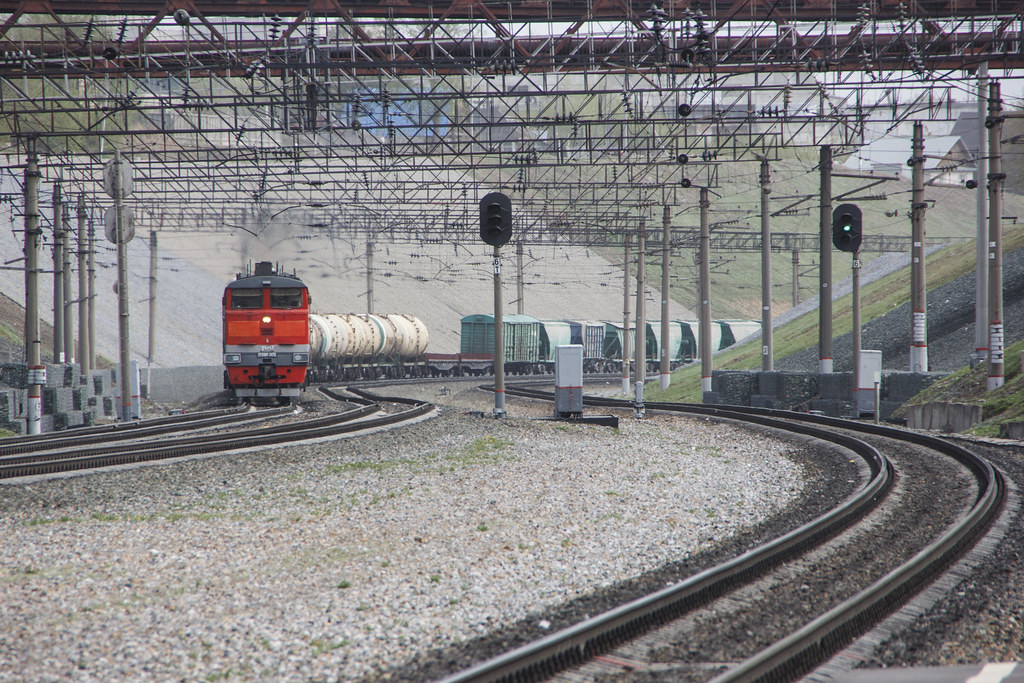 2TE10M-3073 diesel locomotive with freight train