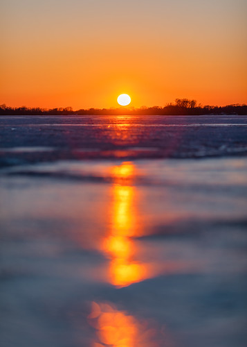 johnwestrock sunset usa wisconsin beaverdam winter sun cold ice nature vertical outdoors nopeople noclouds canonef135mmf2lusm canoneos5dmarkiv
