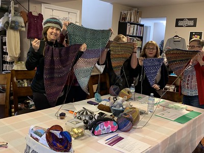 Part of our Wednesday Nightshift Shawl - Learn Mosaic Knitting Knit-Along class with their beautiful WIPs on their needles!