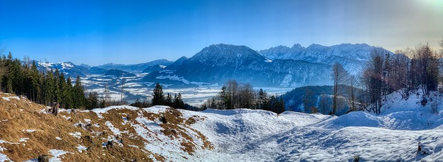 Winter panorama of river Inn valley and Kaiser mountains seen from Schwarzenberg mountain near Oberaudorf, Bavaria, Germany