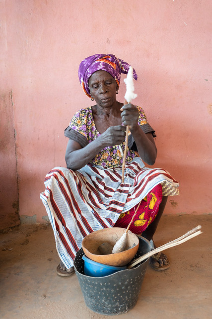Senufo woman spinning cotton