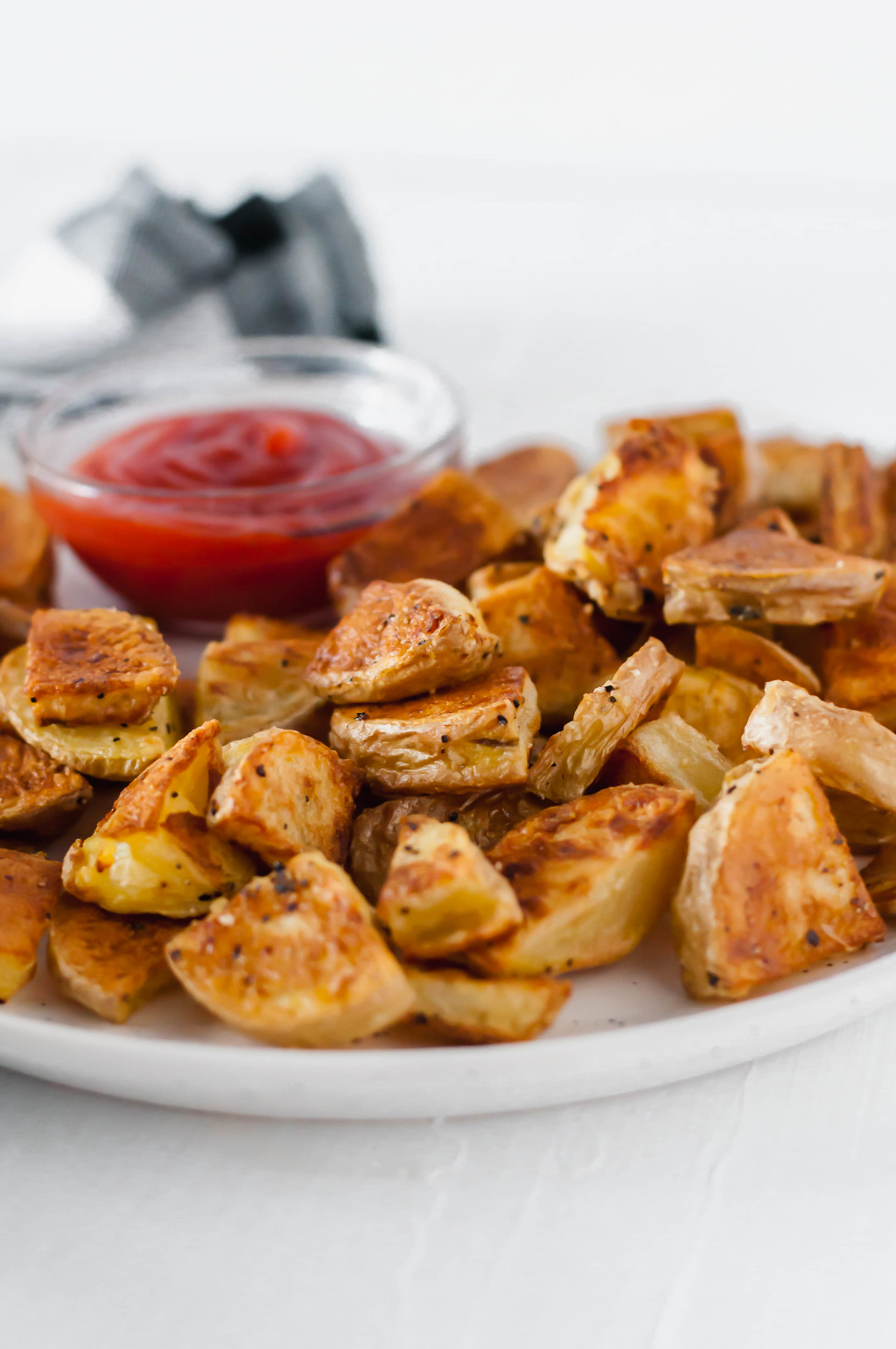 Learn how to make the crispiest potatoes around. These Crispy Roasted Potatoes are simple to make. The crispy exterior and tender, fluffy interior will blow your mind. Read the post for all the tips on making crispy roasted potatoes.