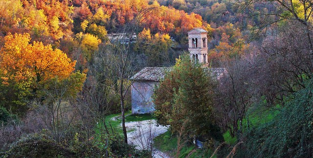The medieval church in the woods, in Autumn