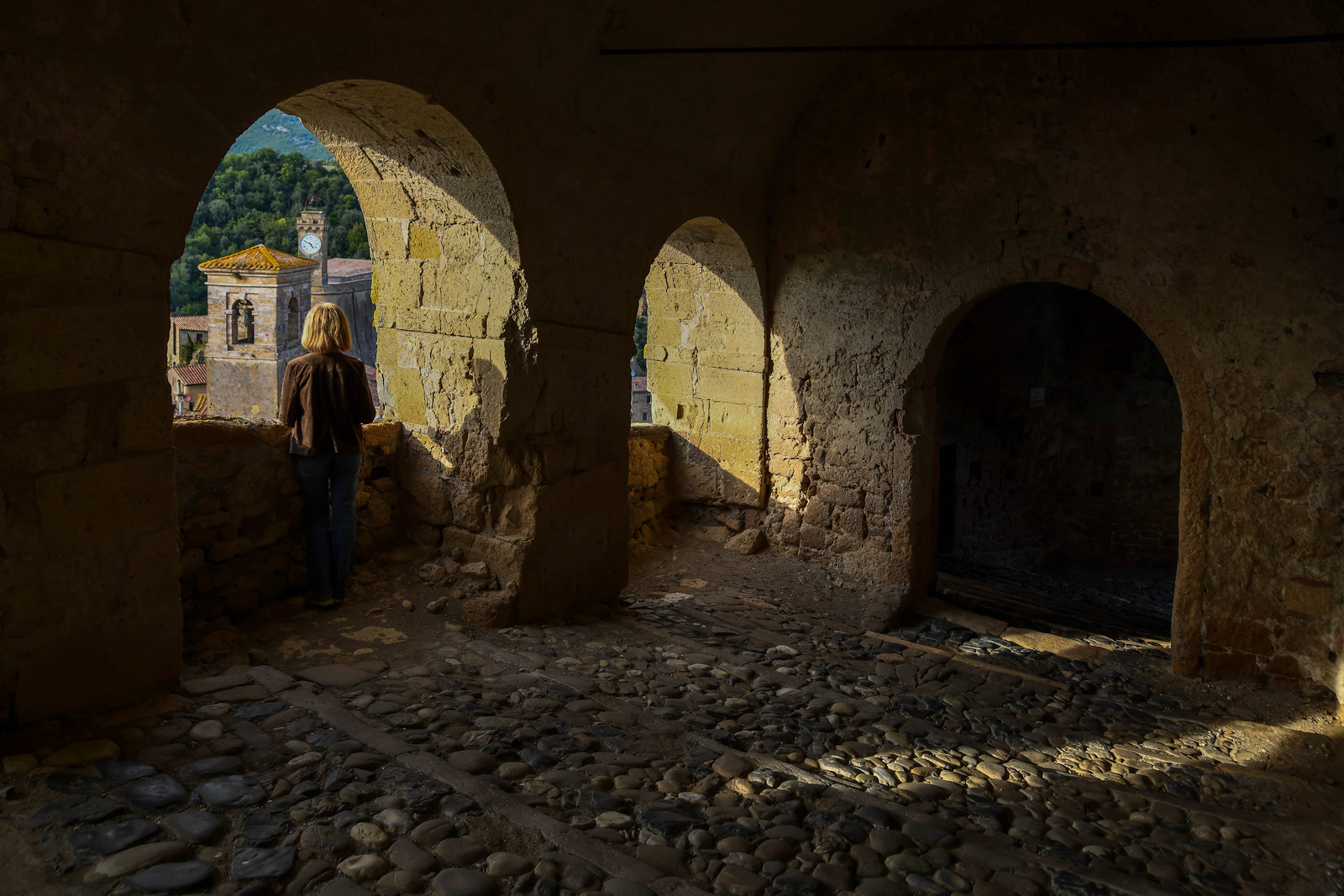 Stone arches overlooking Sorano, a village in the Maremma region of Tuscany, Italy