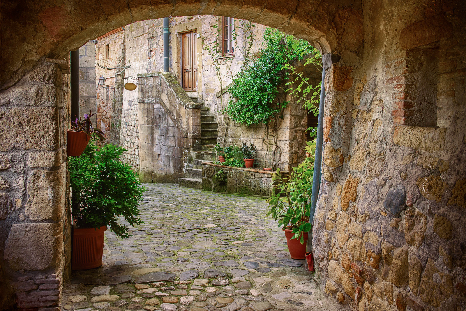 A stone archway in Sorano, one of the best towns in Tuscany to visit