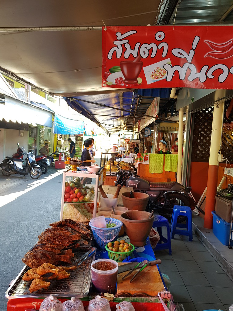 Thai salad and fish hawker stall next to Cafe @ KafeSud in Muang Thai - Phatra morning Market, Bangkok Thailand