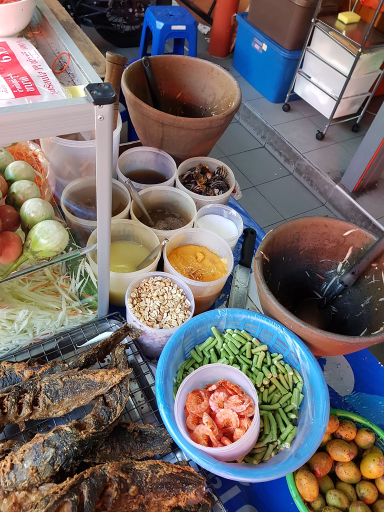 Thai salad and fish hawker stall next to Cafe @ KafeSud in Muang Thai - Phatra morning Market, Bangkok Thailand