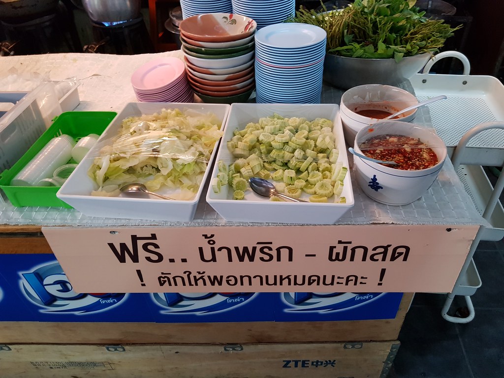 Small free salad and condiments in Thai mixed rice stall @ Khrasunangtika mixed rice stall in Muang Thai - Phatra morning Market, Bangkok Thailand