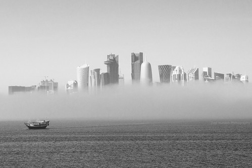 zhunesh qatar doha cityscape skyline reflection boats dhow skyscraper city canon 650d cloudy winter landscape seascape fog foggy blackandwhite