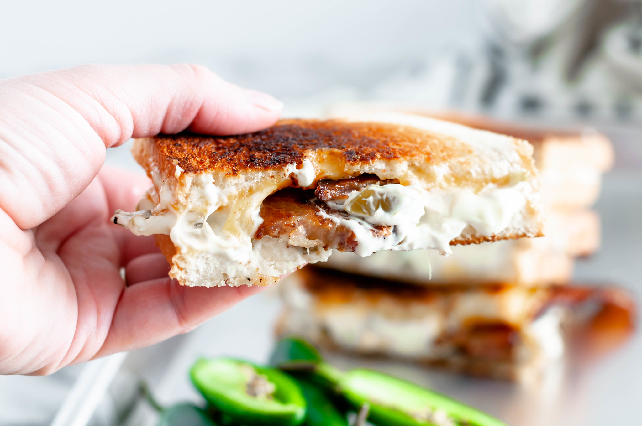 Meet your new favorite sandwich, the Jalapeno Grilled Cheese. Jalapeno jelly, cream cheese, pickled jalapenos, sharp cheddar and bacon combine to make the most glorious sandwich around.