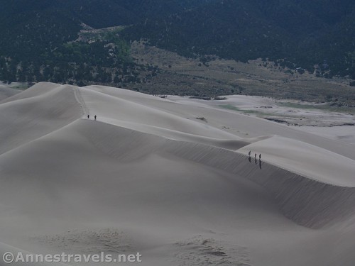 People walking up the lower dunes in Great Sand Dunes National Park, Colorado