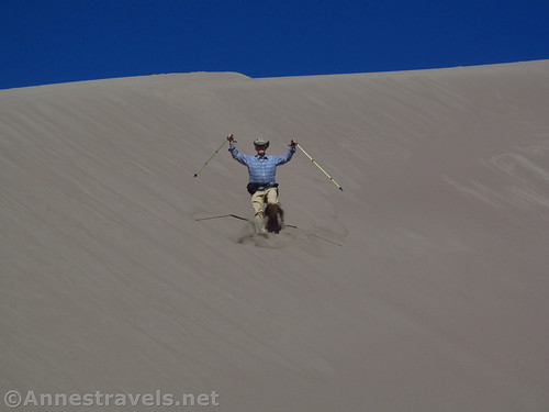 The oldest member of my group jumping down the sand dunes, Great Sand Dunes National Park, Colorado