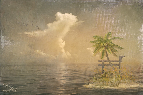 An image of a composite containing the ocean and a small island