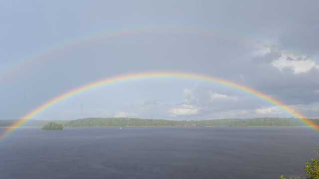 Heavy rain and double rainbow over lake Kolsnaren, Sjöhagen, Södermanland, Sweden