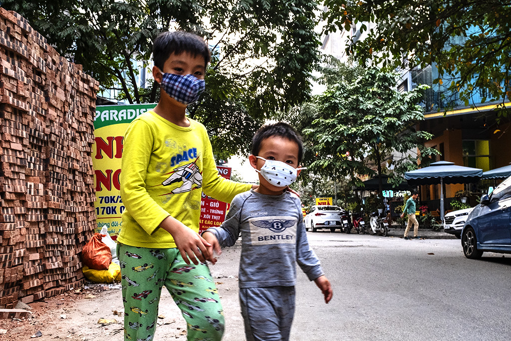 Two boys with medical masks on 2-26-20--Hanoi
