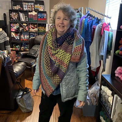 I snapped a photo of Kathy when she arrived today! Check out her finished Nightshift Shawl by Andrea Mowry!