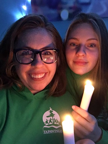 Camp Tapawingo campers smiling holding candles