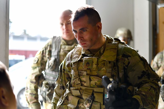 U.S. Army Staff Sgt. Thomas Palos participates in an indoor firing range training evolution