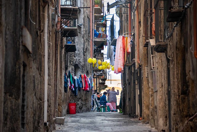Street life in the narrow streets of Palermo on the island of Sicily, Italy.