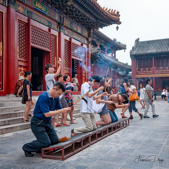 Worshippers outside The Hall of Everlasting Protection at the Yonghe Temple