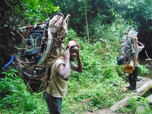porters carry bikes, tents etc