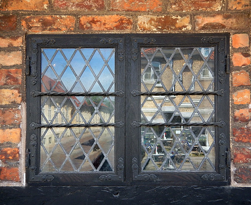 Leaded windows reflect the town of Koge, Denmark