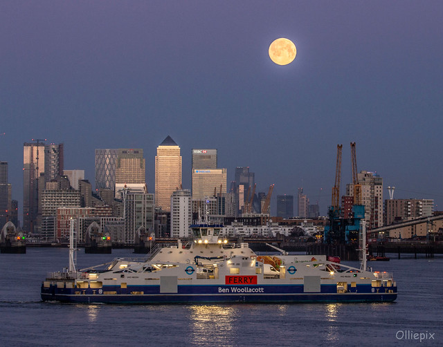 A 99.7% Waxing Gibbous moon sets over London's Canary Wharf and the Woolwich Ferry the Ben Wollacott, Monday morning, March 9, 2020.