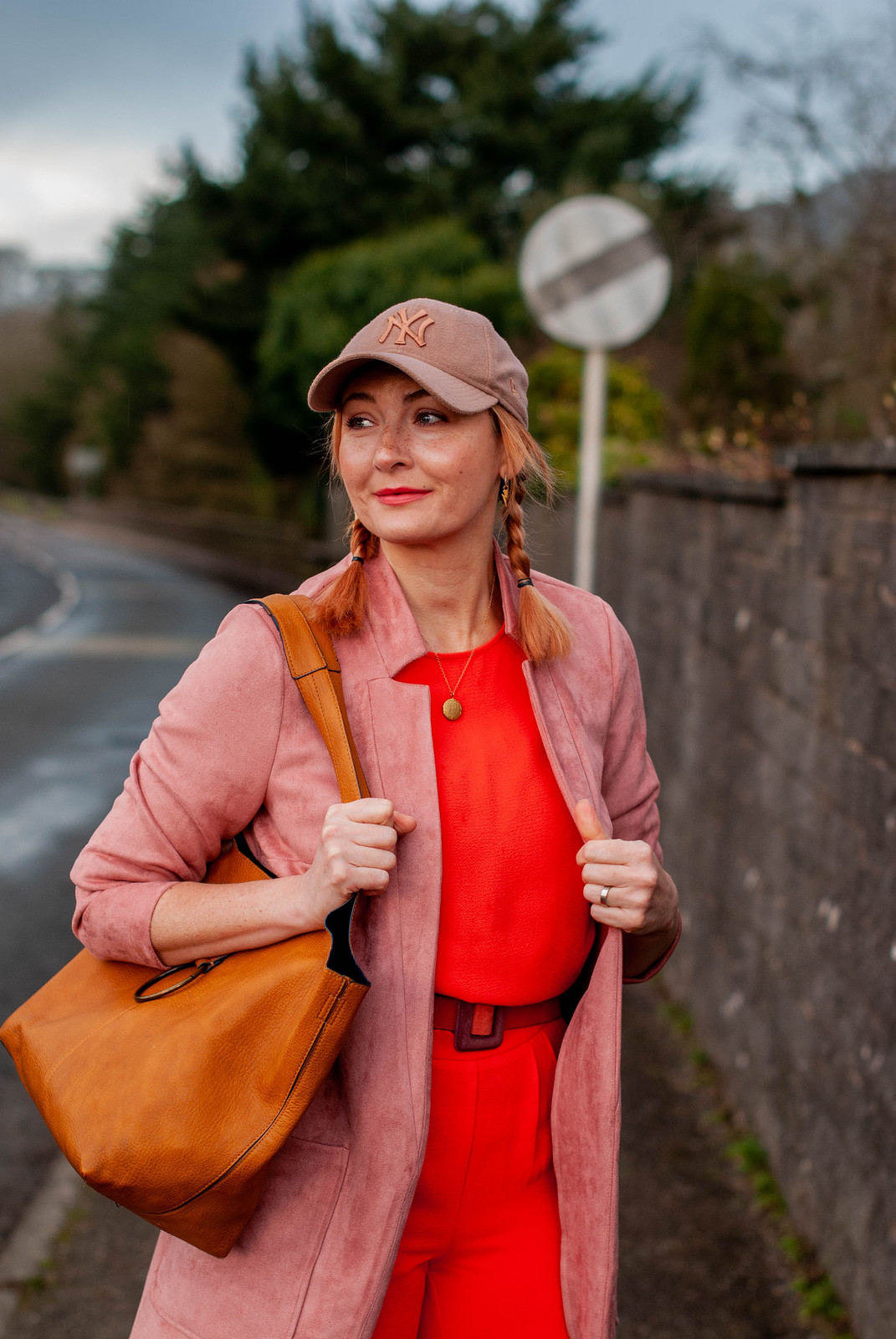 A Comfy, Casual Outfit Without Jeans (But With Trainers) - orange jumpsuit, pink longline blazer, rose gold trainers, taupe baseball cap | Not Dressed As Lamb, Style Over 40