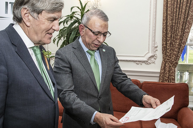 Irish Ambassador to the United States Daniel Mulhall (left) and USDA Deputy Administrator Osama El-Lissy review the plant health (phytosanitary) certificate