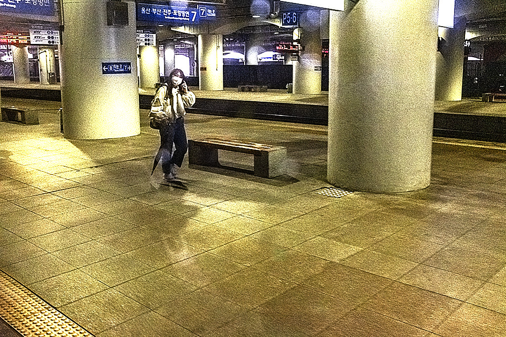 Woman on train platform--Daegu