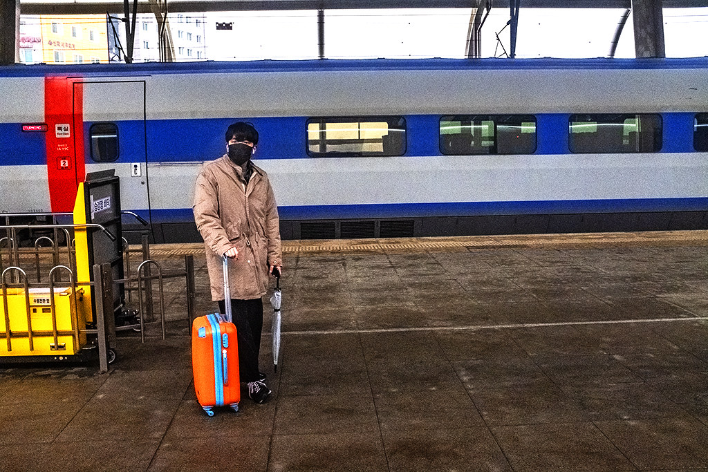 Man waiting on train platform--Osong