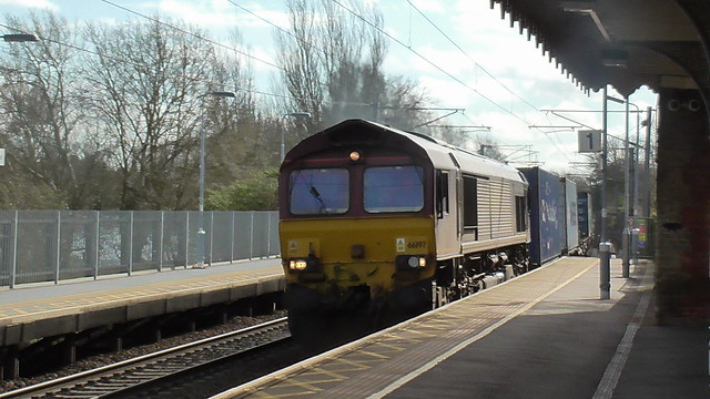 66 197 passes through Needham Market Station hauling a container train.